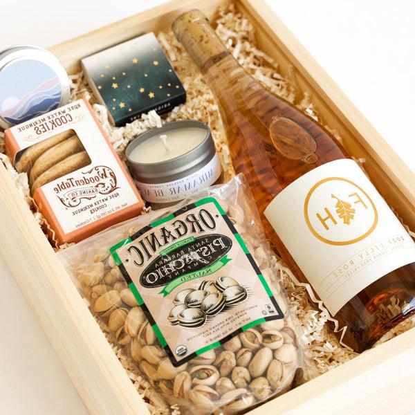 Closeup view of the Lilly Rose California Wine Gift Box with Wine, Candle, Cookies, Pistachios, Matches.